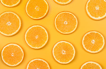 background sliced orange circles on yellow background