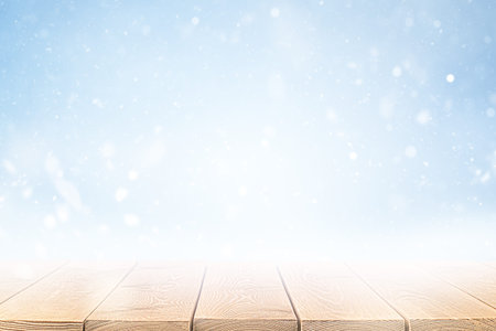 wooden table in the foreground, winter landscape in the background