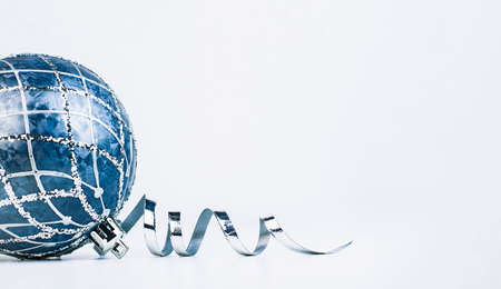christmas ornament and ribbon on light gray backgroundの写真素材