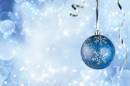 one blue christmas ornament on blue defocus backgroundの写真素材