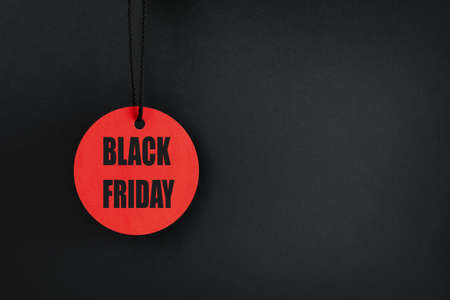 one circle red tag on a black background with the inscription Black Fridayの写真素材
