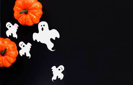 ghosts and pumpkins for halloween on black backgroundの写真素材