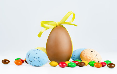 Easter eggs and sweets on a light background