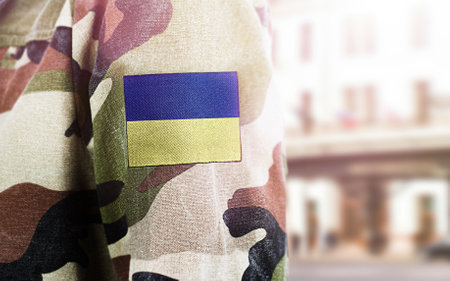 military uniform with ukrainian flagの写真素材