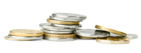 heap of coins on a white isolated backgroundの写真素材
