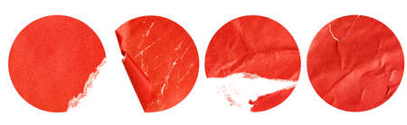 four red damaged round stickers on a white isolated backgroundの写真素材