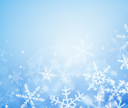 snowflakes on a light blue background close-up. background for christmas and winterの写真素材