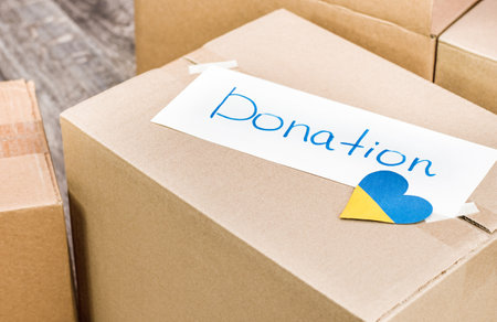 cardboard boxes with inscription Donations close-up. help and support for Ukraineの写真素材