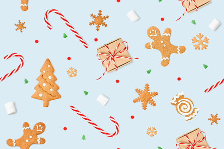 seamless pattern of Christmas decorations and sweets on a blue background