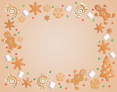 Christmas background with frame of gingerbread, marshmallows and confettiの写真素材