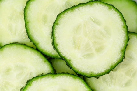 round slices of sliced cucumber close-upの写真素材