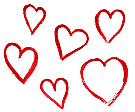 outlines of hearts drawn with watercolor red paint on a white isolated backgroundの写真素材