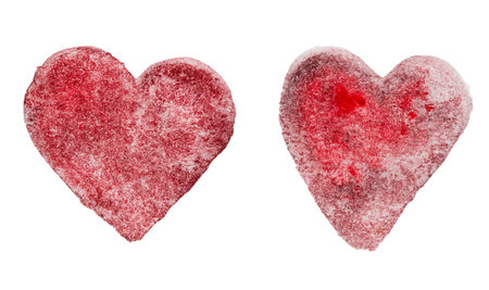 two burgundy hearts drawn with watercolor paints on a white isolated backgroundの写真素材