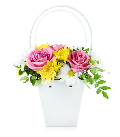 bouquet of roses, daisies and chrysanthemums in a cardboard basket on a white isolated background. front viewの写真素材