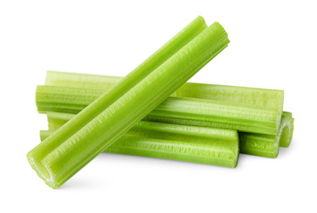 chopped celery stalks on isolated white background, front viewの写真素材