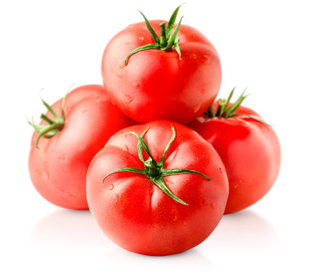 four tomatoes on isolated white backgroundの写真素材