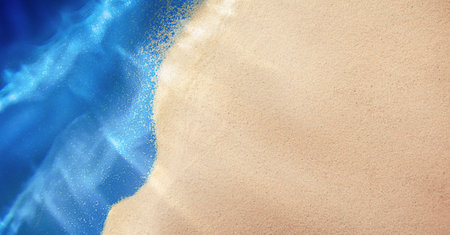 summer background with sea sand and sea waves, top viewの写真素材