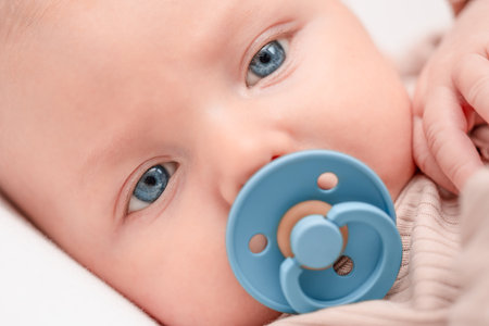 baby with pacifier extreme close-upの写真素材