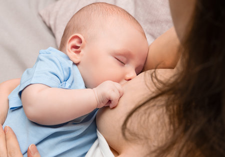 mother breastfeeding her newborn baby, close upの写真素材