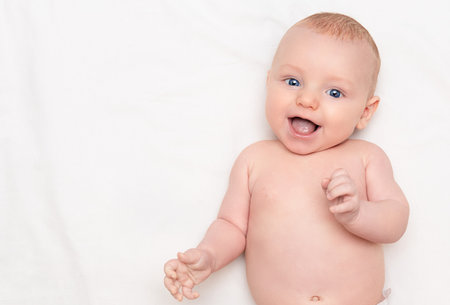 happy baby on light background, top viewの写真素材