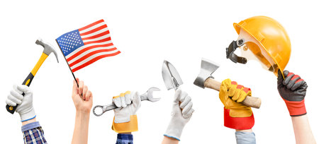 six different hands with working tools and American flag on white isolated background. labor day conceptの写真素材