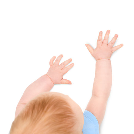 baby's hands reaching for something, isolated on white backgroundの写真素材