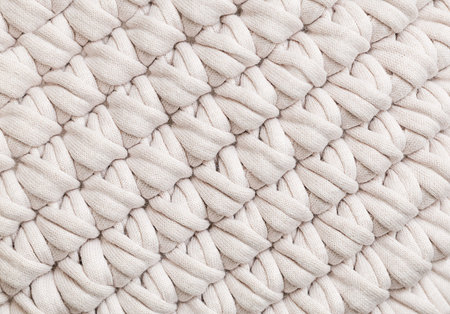 Woven textured beige background close up