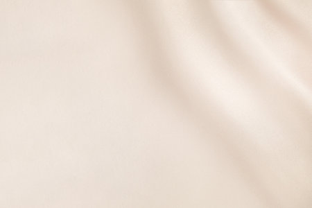 soft silk background with cream-colored foldsの写真素材