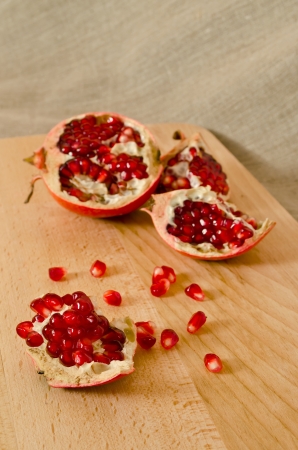 Pomegranate on wooden boardの写真素材