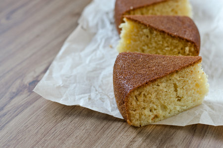 Sliced cake with semolina on a paper.