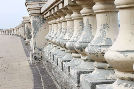 railings stand on a pedestrian walkwayの写真素材