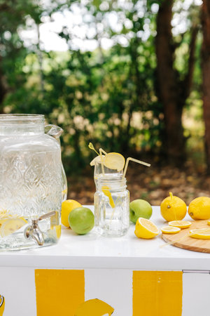 An empty lemonade stand ready for children to start selling lemonade on a hot summer day as their first business endeavor.の写真素材