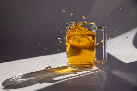 A cup of black tea, isolated on a white background with shadows with splashes. Copy spaceの写真素材