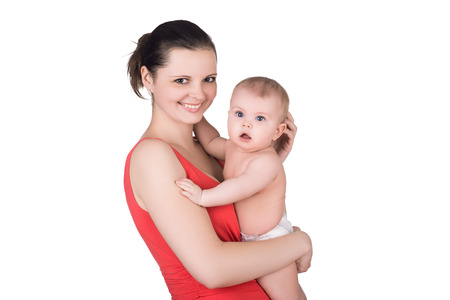 smiling young mother holding her cute baby child isolated on white. happy family conceptの写真素材