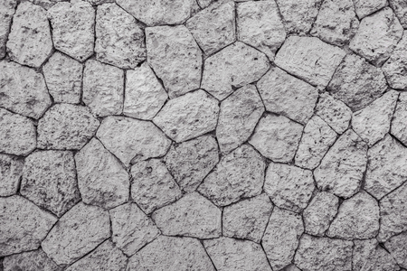 Fragment of natural stone wall texture - Image. Background of chipped stones.の写真素材