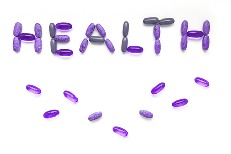 Word "health" made of medicine pills on white background. Inscription medicine from a set of pills.の写真素材