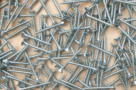 metal nails screwsmacro flat lay backgroundの写真素材