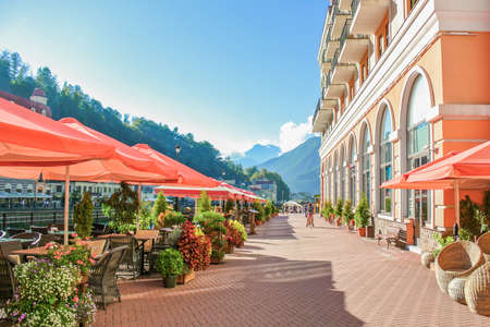 Sochi, Russia, Rosa Khutor, 2018. Tourist street with cafes and hotels, mountain view. Summer time. Traveling, adventures.の写真素材