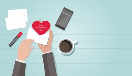 Valentine day. Man holding envelope with red heart, coffee, phone, marker on the tableのイラスト素材