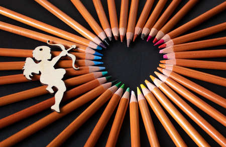bright heart-shaped pencils and an angelの写真素材