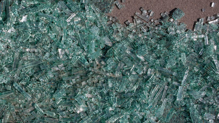 background of transparent green tempered triplex winshield glass broke into small pieces due to car...