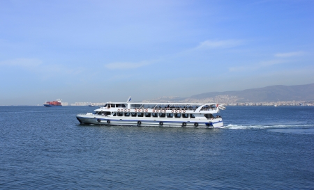 Passenger ship on Izmir bay on Izmir background のeditorial素材