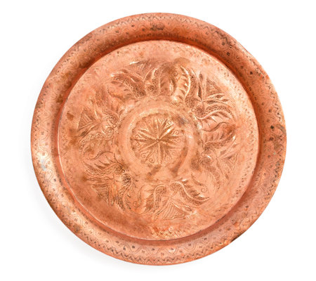 vintage handmade copper tray with carved pattern handmade isolated on white backgroundの写真素材