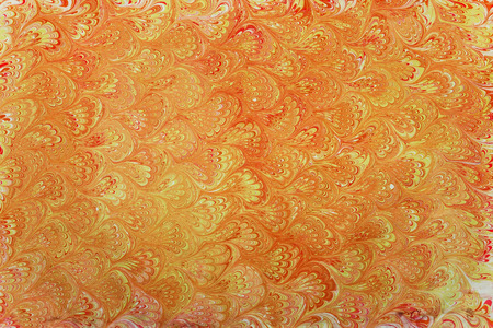 traditional Turkish Ebru technique. painting on water, followed by paper prints. golden color ebru patterned fanの写真素材