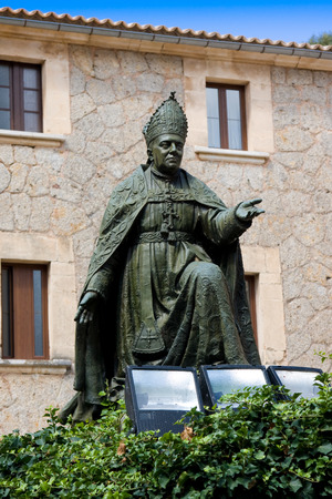 Memorial to bishop Pere-Joan Campins in cloistered courtyard of Santuario de lluc Monastery, county of Escorca in basin of the Serra Tramuntana Mountains on Mallorca の写真素材