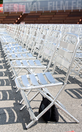 Rows of empty chairs on squareの写真素材