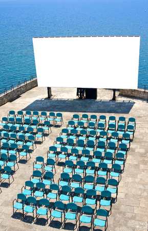 Blank billboard for your advertesing and seats against seaの写真素材
