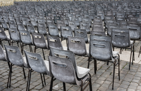 Rows of old empty chairs on square, Vaticanの写真素材