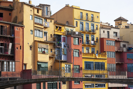 Girona, Spain - January 23, 2019: Colorful houses of Girona in center of city en embankment of Onyar Riverのeditorial素材