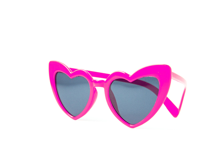 Pink sunglasses heart shape isolated on white backgroundの写真素材